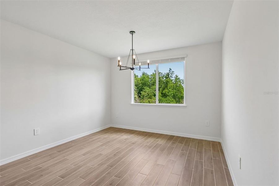 Spacious, unfurnished interior of a new home in The Grove at Stuart Crossing - Signature Series, Bartow (Image 22).