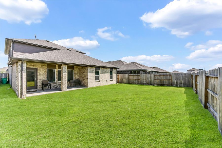 Exterior details and patio area of a home in Sunterra, Katy (Image 2). Exterior details and patio area of a home in Sunterra, Katy (Image 2).