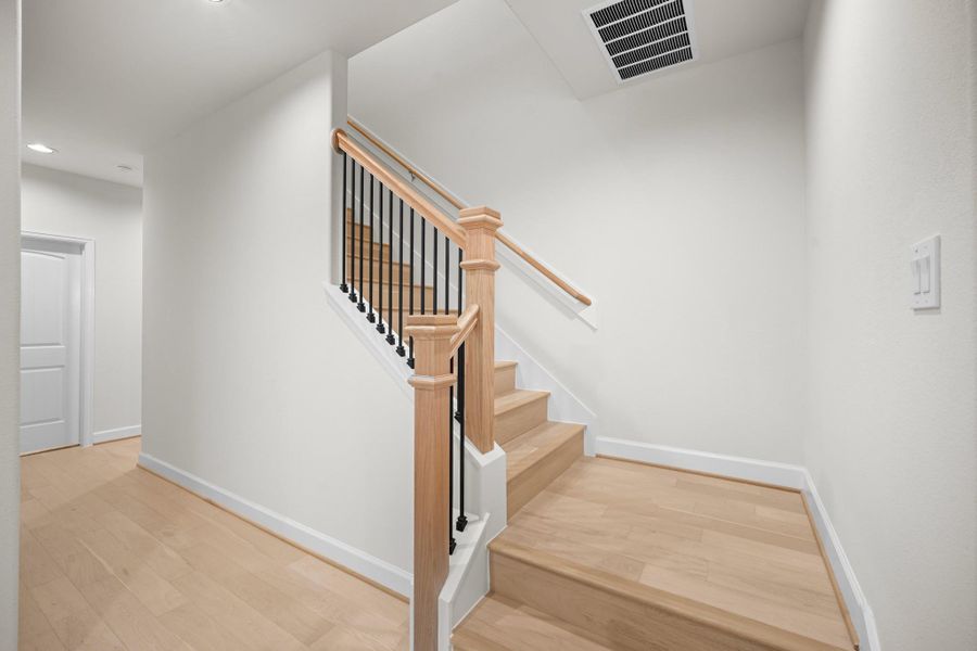 Wood treads and iron balusters on the staircase up to the third floor — a detail that holds up well and signals the quality of construction throughout the home. Wood treads and iron balusters on the staircase up to the third floor — a detail that holds up well and signals the quality of construction throughout the home.