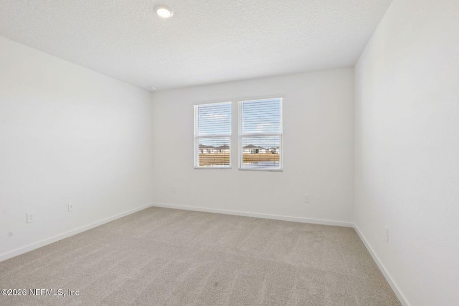 Spacious, unfurnished interior of a new home in Lakes at Bella Lago - Signature Series, Green Cove Springs (Image 25).