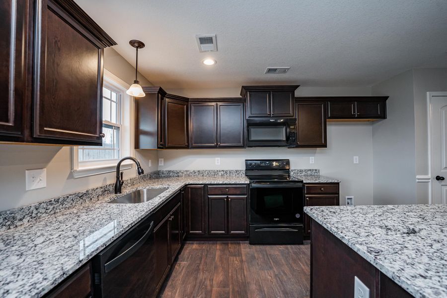 Representative furnished interior of a home built from the Saxon by Enchanted Homes in Guadalupe Heights, Seguin (Image 11).