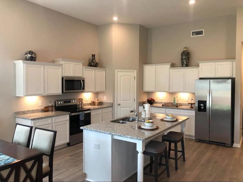 Stock Photo: Home features a large Kitchen Island, Corner Pantry and all Stainless Steel Kitchen Appliances! Stock Photo: Home features a large Kitchen Island, Corner Pantry and all Stainless Steel Kitchen Appliances!