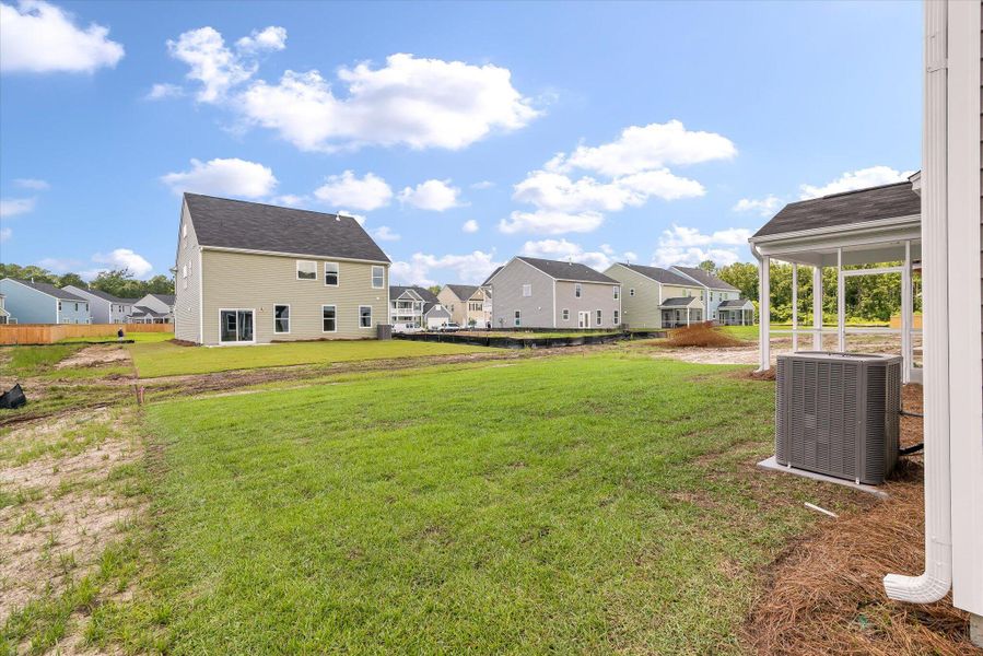 Front exterior of a new home in Oakley Pointe, Moncks Corner, SC, highlighting curb appeal (Image 18).