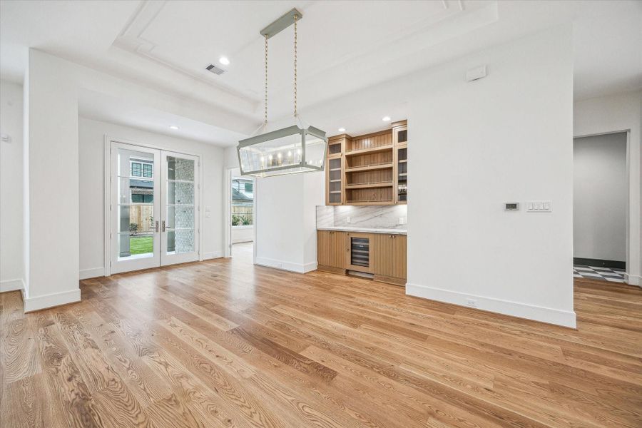 Wonderful Single Dining Space with Serving Bar! White Oak custom cabinetry with Sub Zero Wine Refrigerator. Wonderful Single Dining Space with Serving Bar! White Oak custom cabinetry with Sub Zero Wine Refrigerator.