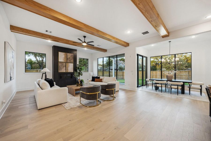 Expansive living room with tons of natural light emitted through the 9' tall picture windows throughout the living and dining rooms Expansive living room with tons of natural light emitted through the 9' tall picture windows throughout the living and dining rooms