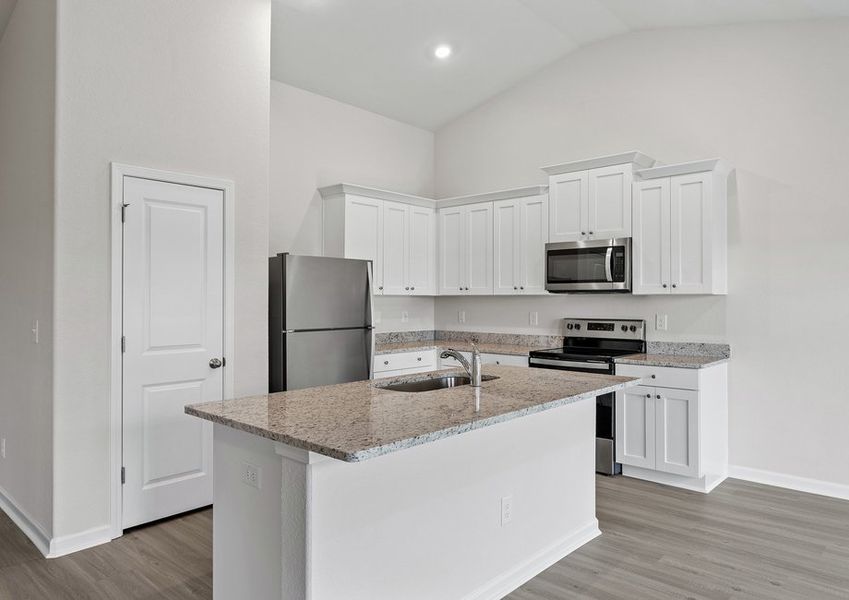 The kitchen boasts stainless-steel appliances