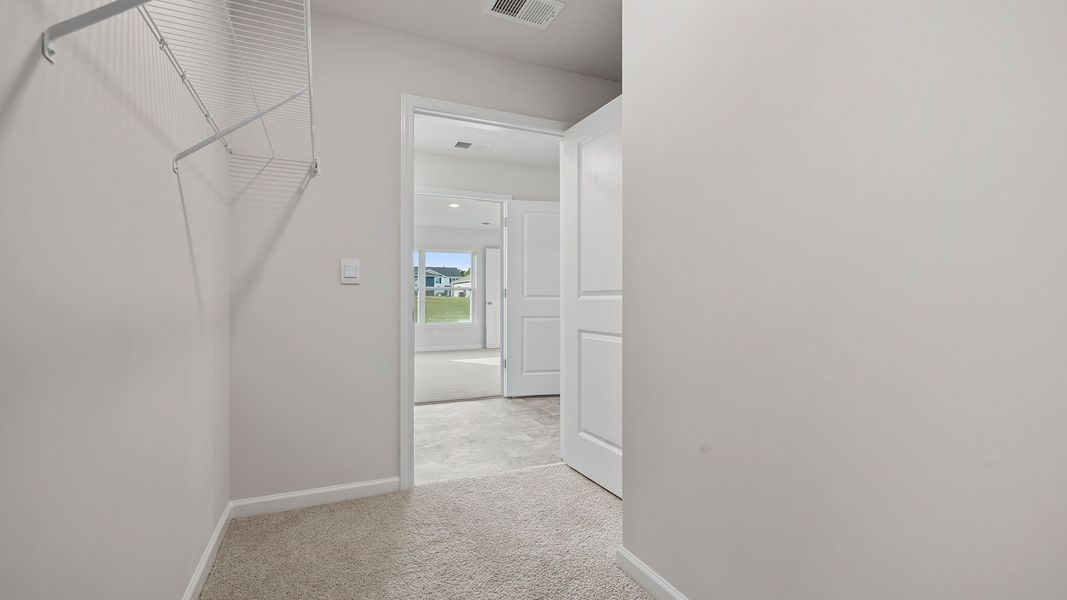 Spacious, unfurnished interior of a new home in Bentley Park, Greenwood (Image 28).