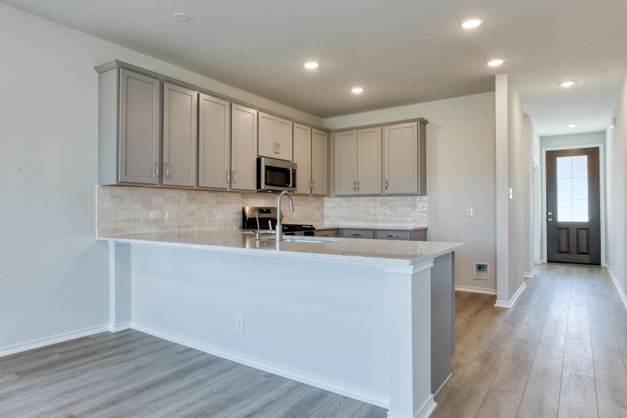 Representative furnished interior of a home built from the Cassidy by Ashton Woods in The Arbors at the Wilder, Adkins (Image 15).