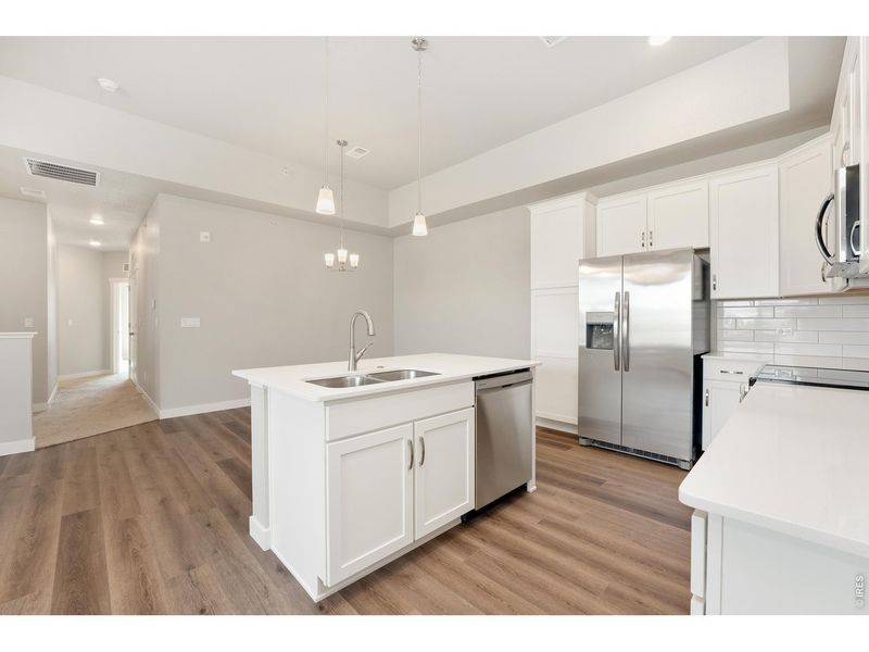 Furnished interior view inside a new home in The Lakes at Centerra - Discovery, Loveland (Image 8).