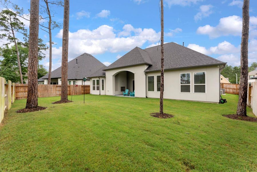 Exterior details and patio area of a home in , Conroe (Image 2).
