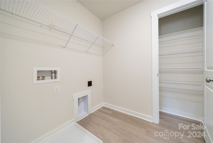 Laundry Room up featuring linen closet