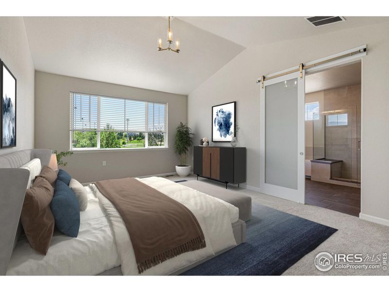 Image Virtually Staged. Primary bedroom with barn door to bathroom