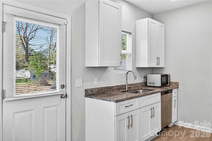 Kitchen with side entry door