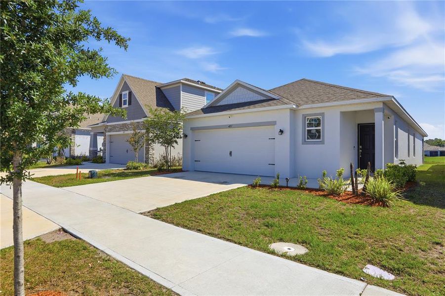 Front exterior of a new home in , St. Cloud, FL, highlighting curb appeal (Image 28).