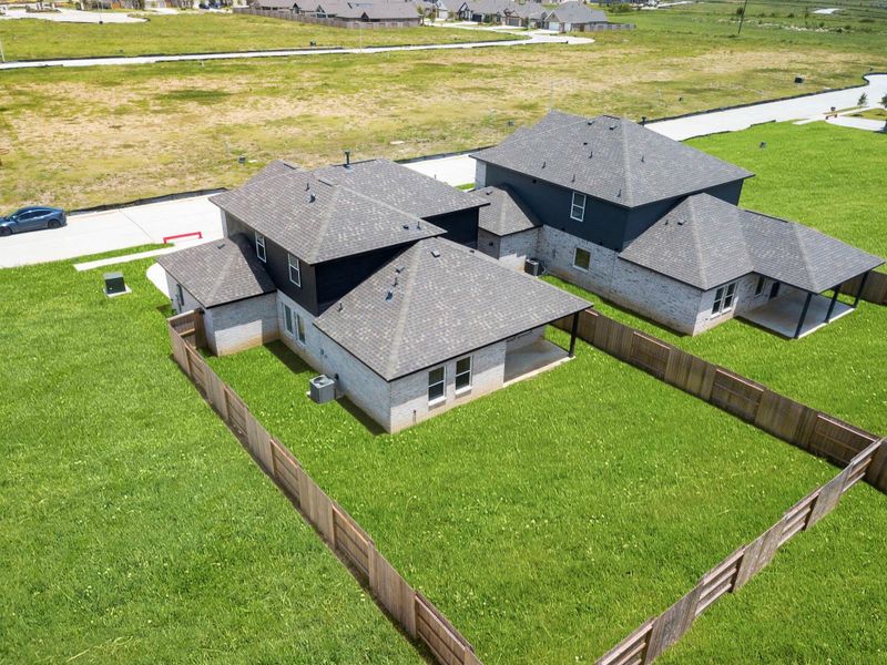 Backyard aerial showing the spacious fenced yard—perfect for outdoor fun, pets, and gardening. Backyard aerial showing the spacious fenced yard—perfect for outdoor fun, pets, and gardening.