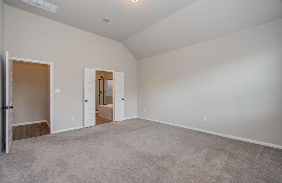 Another angle of the spacious primary bedroom