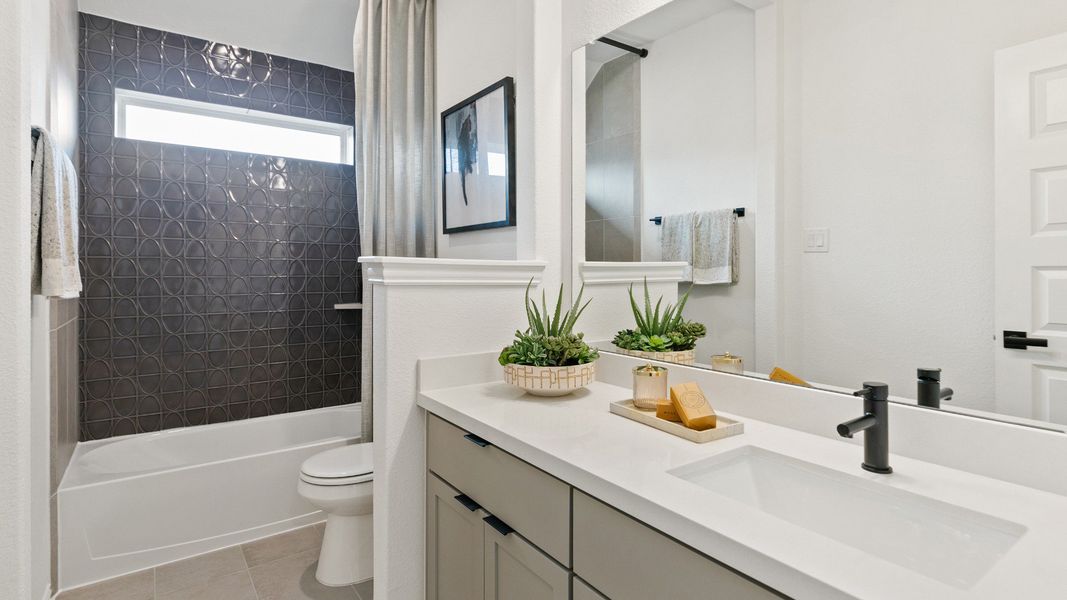 Representative furnished interior of a home built from the Mimosa by DRB Homes in Brookewater, Rosenberg (Image 25).