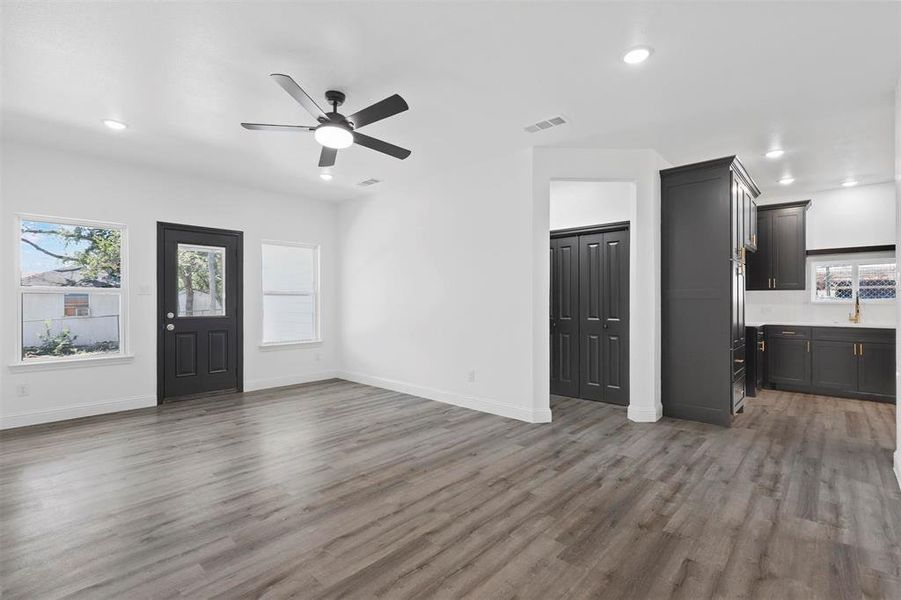 Foyer featuring ceiling fan and wood-type flooring