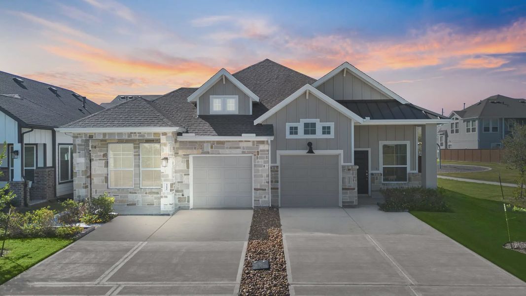 Representative exterior photo of a completed home built from the Carriagehouse by Chesmar Homes in Meridiana Townhomes, Iowa Colony, TX (Image 29).