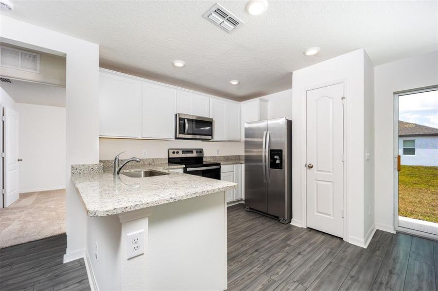Furnished interior view inside a new home in Gum Lake Preserve, Lake Alfred (Image 5). Furnished interior view inside a new home in Gum Lake Preserve, Lake Alfred (Image 5).