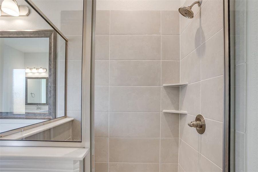 Bathroom featuring a shower with shower door