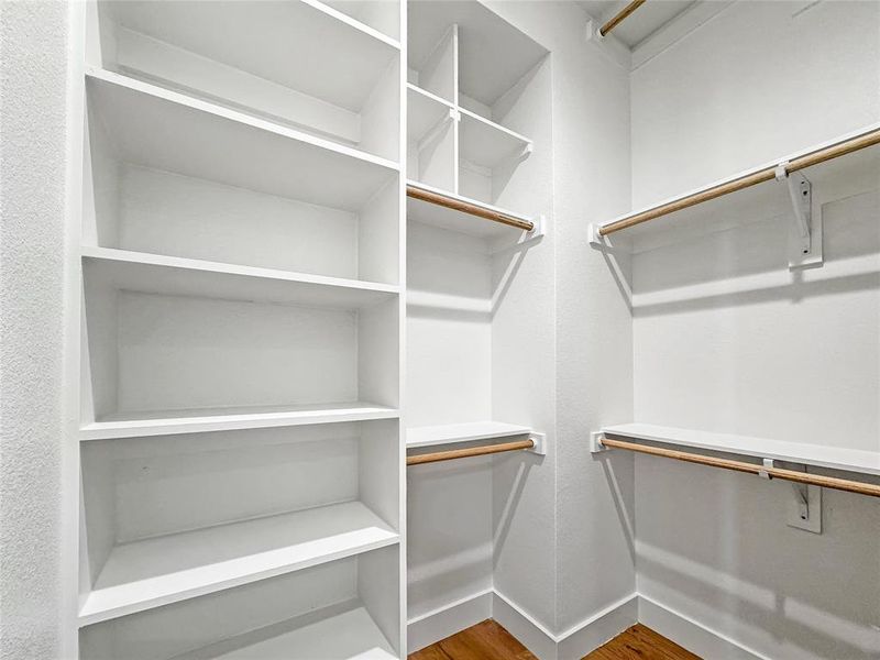 Spacious closet with wood finished floors