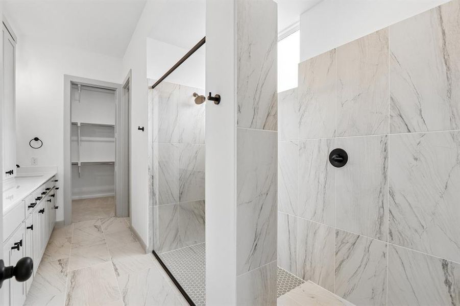 Featuring a luxurious walk in shower with drying area and a dream closet with seasonal hanging space, you'll enjoy a spa like experience every day in this wonderful owner's bath! Featuring a luxurious walk in shower with drying area and a dream closet with seasonal hanging space, you'll enjoy a spa like experience every day in this wonderful owner's bath!