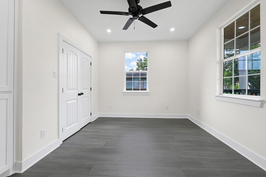 Bright and versatile third room with sleek flooring, large windows, and modern lighting. Bright and versatile third room with sleek flooring, large windows, and modern lighting.