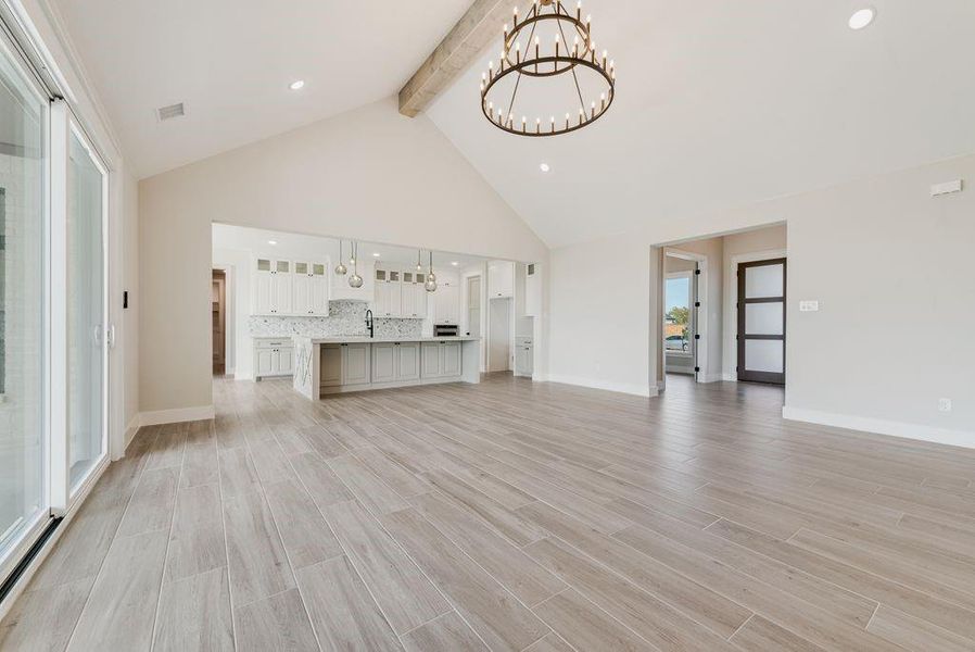 Living room facing Kitchen & entry Living room facing Kitchen & entry