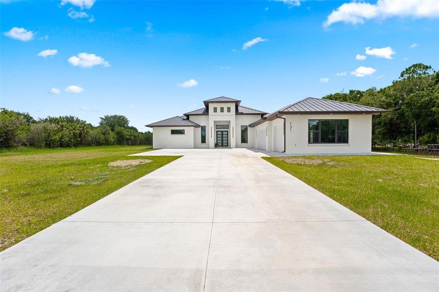 Front exterior of a new home in , Palm Bay, FL, highlighting curb appeal (Image 25). Front exterior of a new home in , Palm Bay, FL, highlighting curb appeal (Image 25).