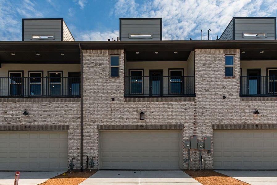 Front exterior of a new home in Bayside, Rowlett, TX, highlighting curb appeal (Image 25).