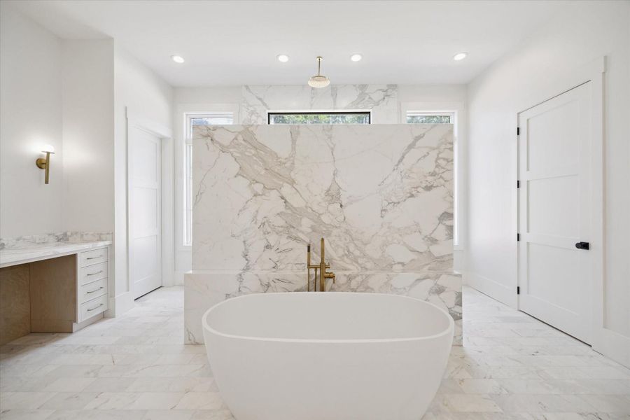 Primary bathroom offers ample natural light, a spacious vanity area, and a sleek, minimalist design. Primary bathroom offers ample natural light, a spacious vanity area, and a sleek, minimalist design.