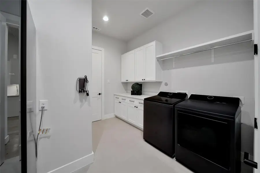 Furnished interior view inside a new home in ARTAVIA, Conroe (Image 10).