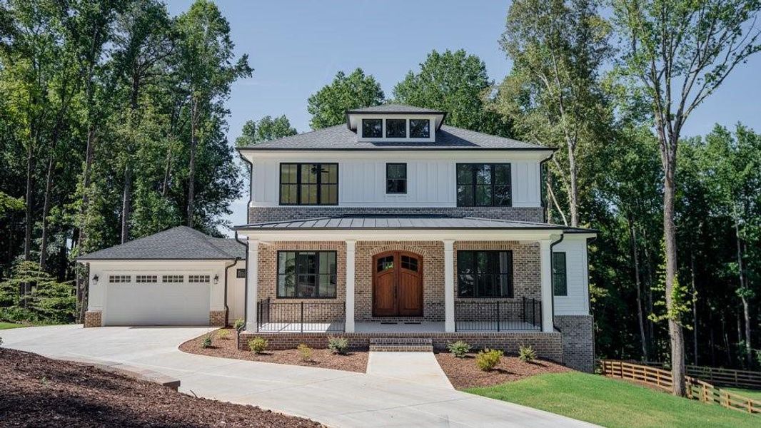 Front exterior of a new home in , Woodstock, GA, highlighting curb appeal (Image 25).