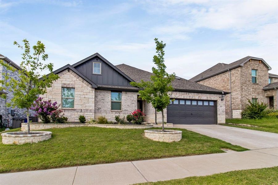 Front exterior of a new home in Wolf Creek Farms - Premier Series, Melissa, TX, highlighting curb appeal (Image 21). Front exterior of a new home in Wolf Creek Farms - Premier Series, Melissa, TX, highlighting curb appeal (Image 21).