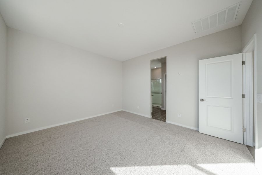 A hallway with white doors. A hallway with white doors.