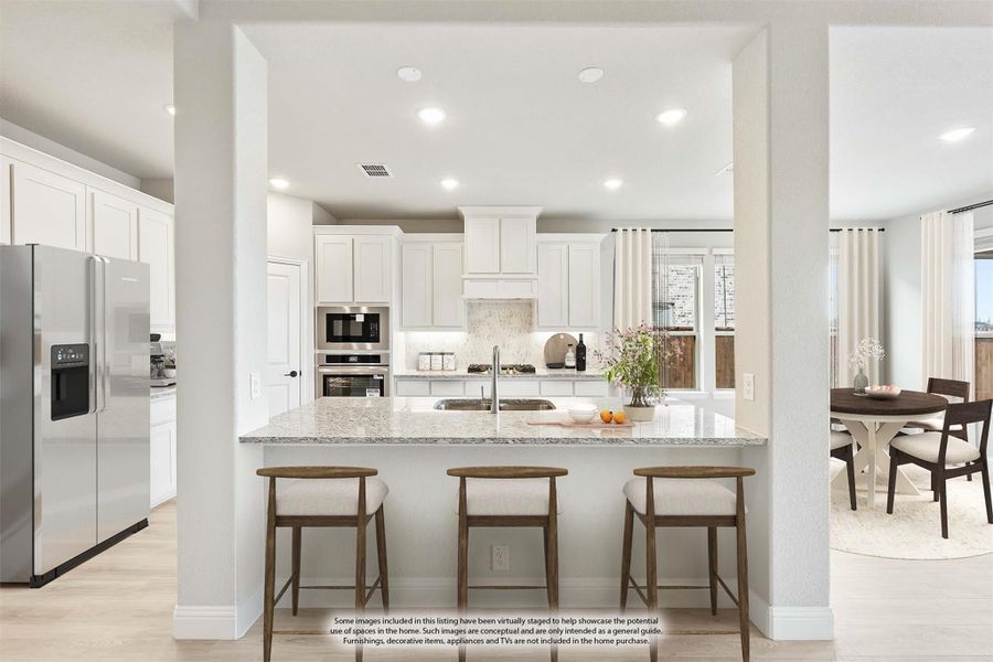 Kitchen with white cabinets, granite island with three bar stools, and stainless steel appliances Kitchen with white cabinets, granite island with three bar stools, and stainless steel appliances