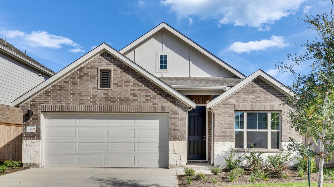 Representative exterior photo of a completed home built from the Maldives by DRB Homes in Briarwood, Elgin, TX (Image 20).