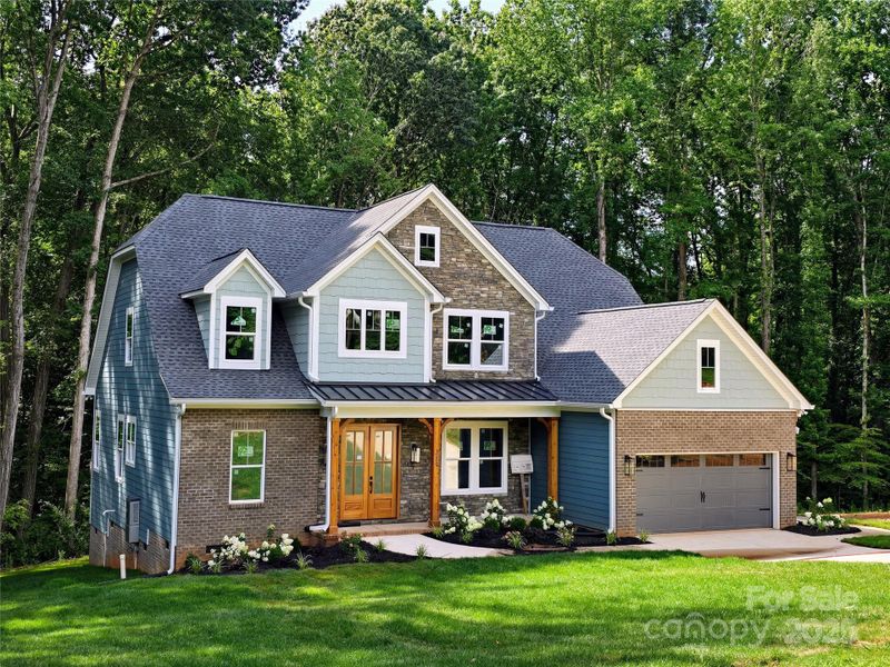 Front exterior of a new home in , Belmont, NC, highlighting curb appeal (Image 25).