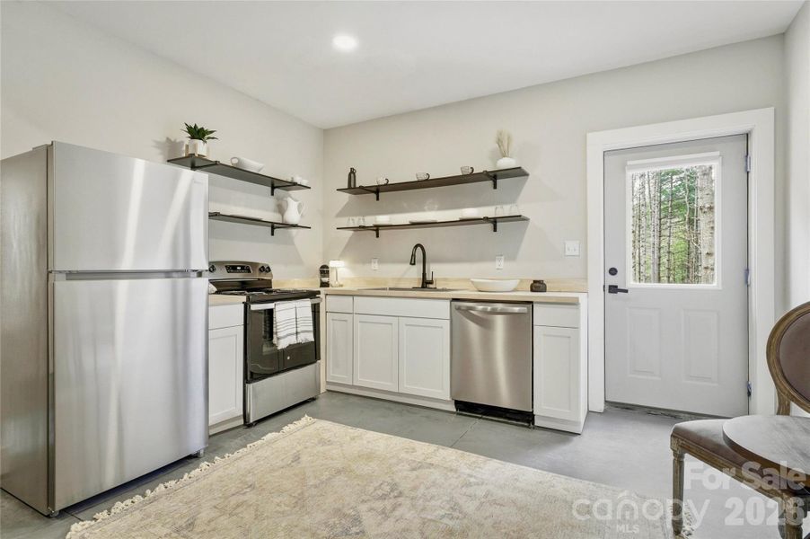 Furnished interior view inside a new home in , Lenoir (Image 15).