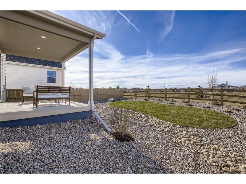 Exterior details and patio area of a home in Farmstead, Berthoud (Image 21).