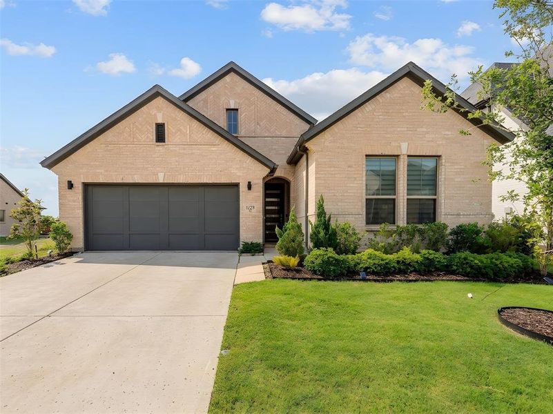 Front exterior of a new home in , Celina, TX, highlighting curb appeal (Image 23).