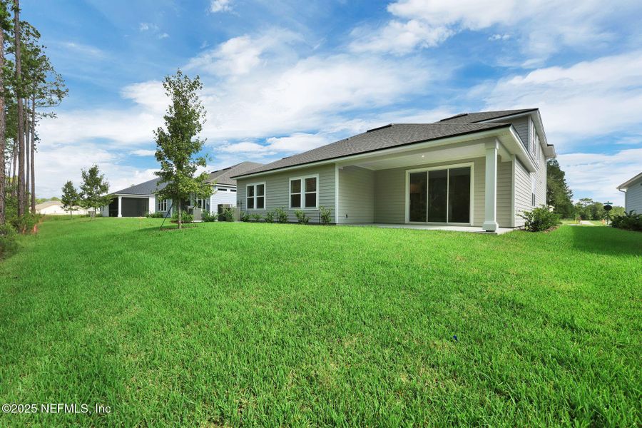 Front exterior of a new home in Trailmark - Phase 10, St. Augustine, FL, highlighting curb appeal (Image 24). Front exterior of a new home in Trailmark - Phase 10, St. Augustine, FL, highlighting curb appeal (Image 24).