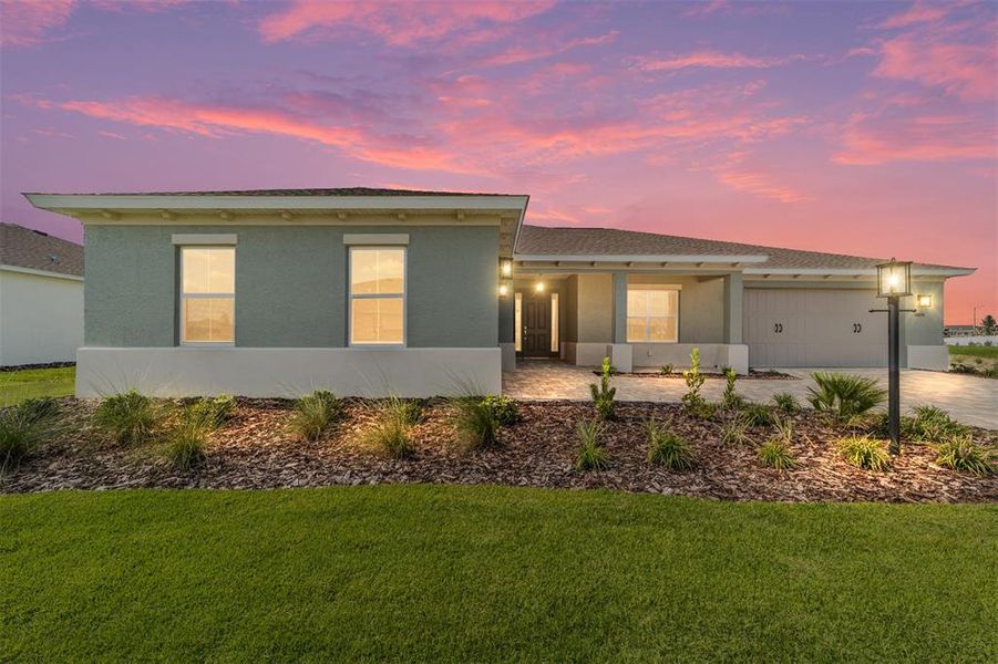 Front exterior of a new home in On Top of the World Communities, Ocala, FL, highlighting curb appeal (Image 1). Front exterior of a new home in On Top of the World Communities, Ocala, FL, highlighting curb appeal (Image 1).
