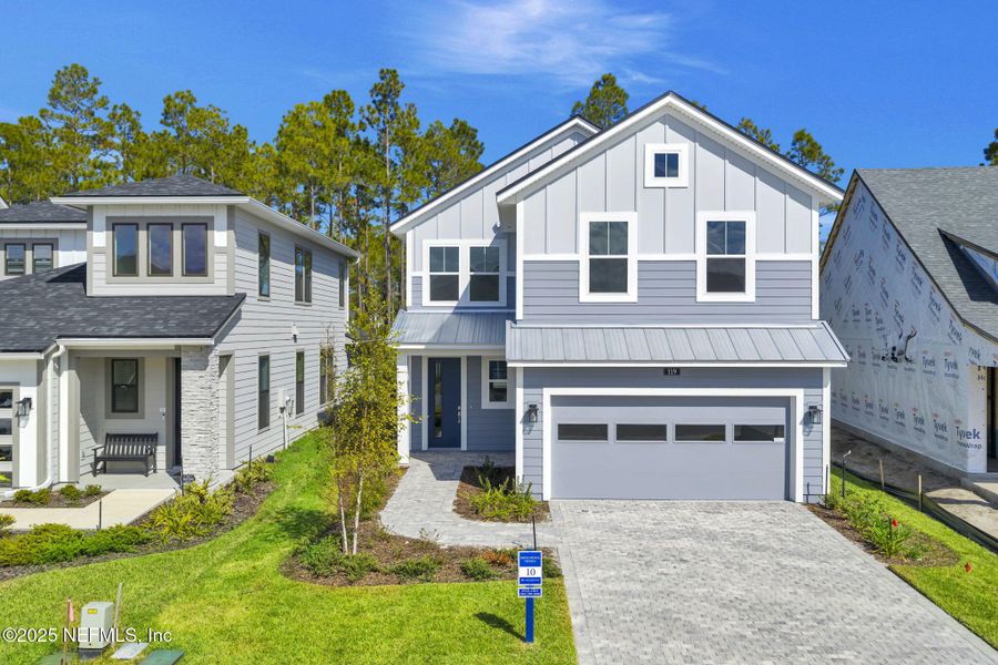 Front exterior of a new home in Crosswinds at Nocatee, Nocatee, FL, highlighting curb appeal (Image 29). Front exterior of a new home in Crosswinds at Nocatee, Nocatee, FL, highlighting curb appeal (Image 29).