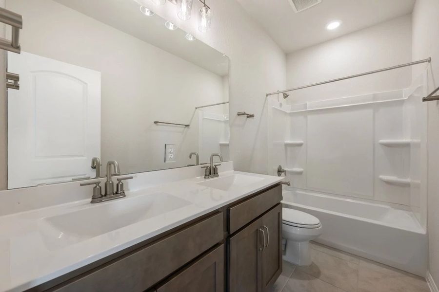 Furnished interior view inside a new home in Rolling Glen, Hutto (Image 14).