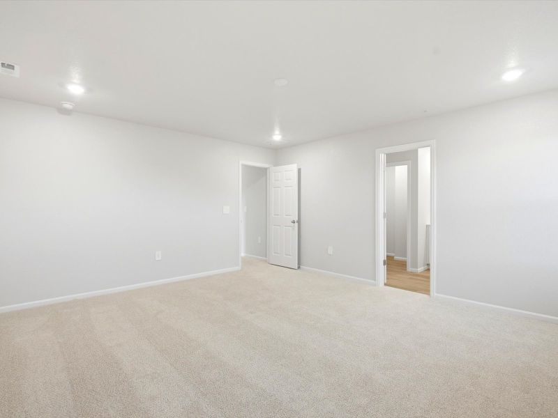 Spacious, unfurnished interior of a new home in Frontier Estates - The Trails Collection, Firestone (Image 12).