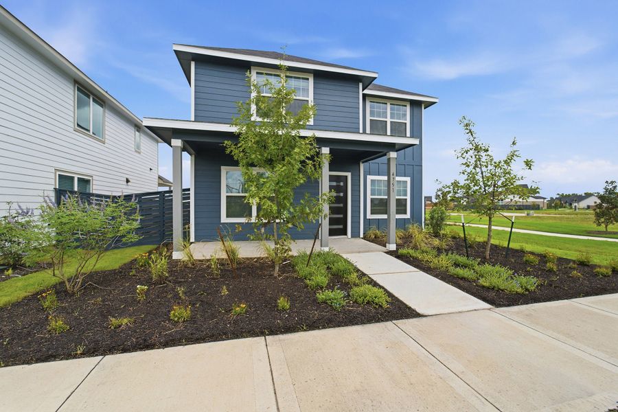 Front exterior of a new home in Austin Point, Richmond, TX, highlighting curb appeal (Image 2).
