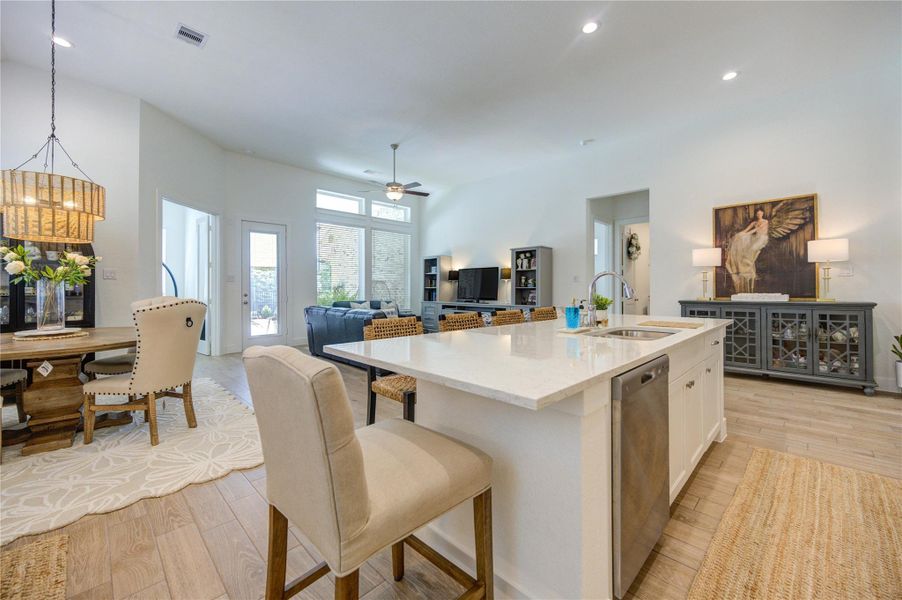 The oversized island creates the perfect gathering spot while keeping the kitchen connected to the living spaces. The oversized island creates the perfect gathering spot while keeping the kitchen connected to the living spaces.