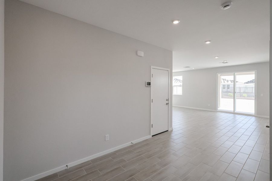 A room with white walls and a white door.